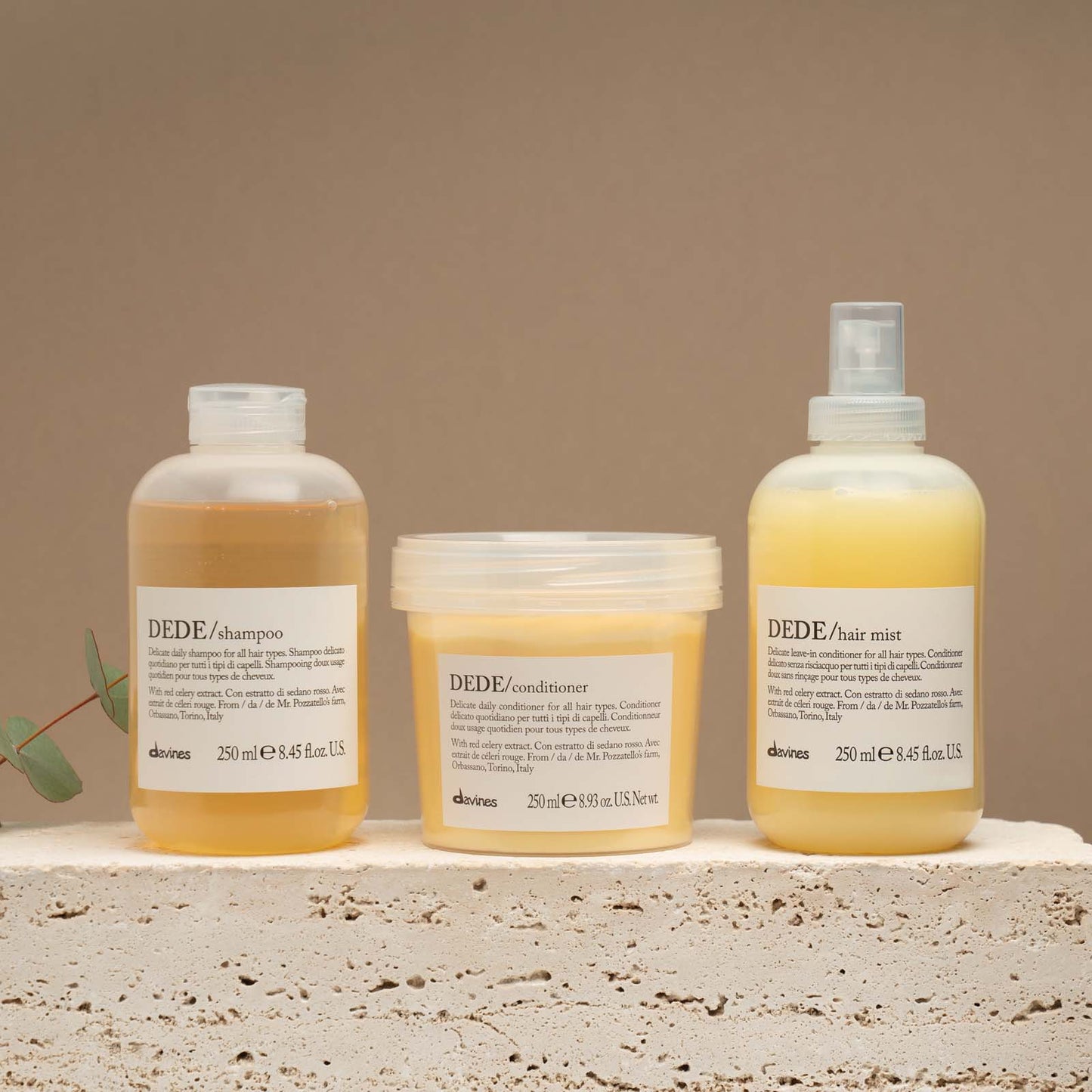 Three Davines DEDE delicate hair care products including shampoo, conditioner, and hair mist for all hair type