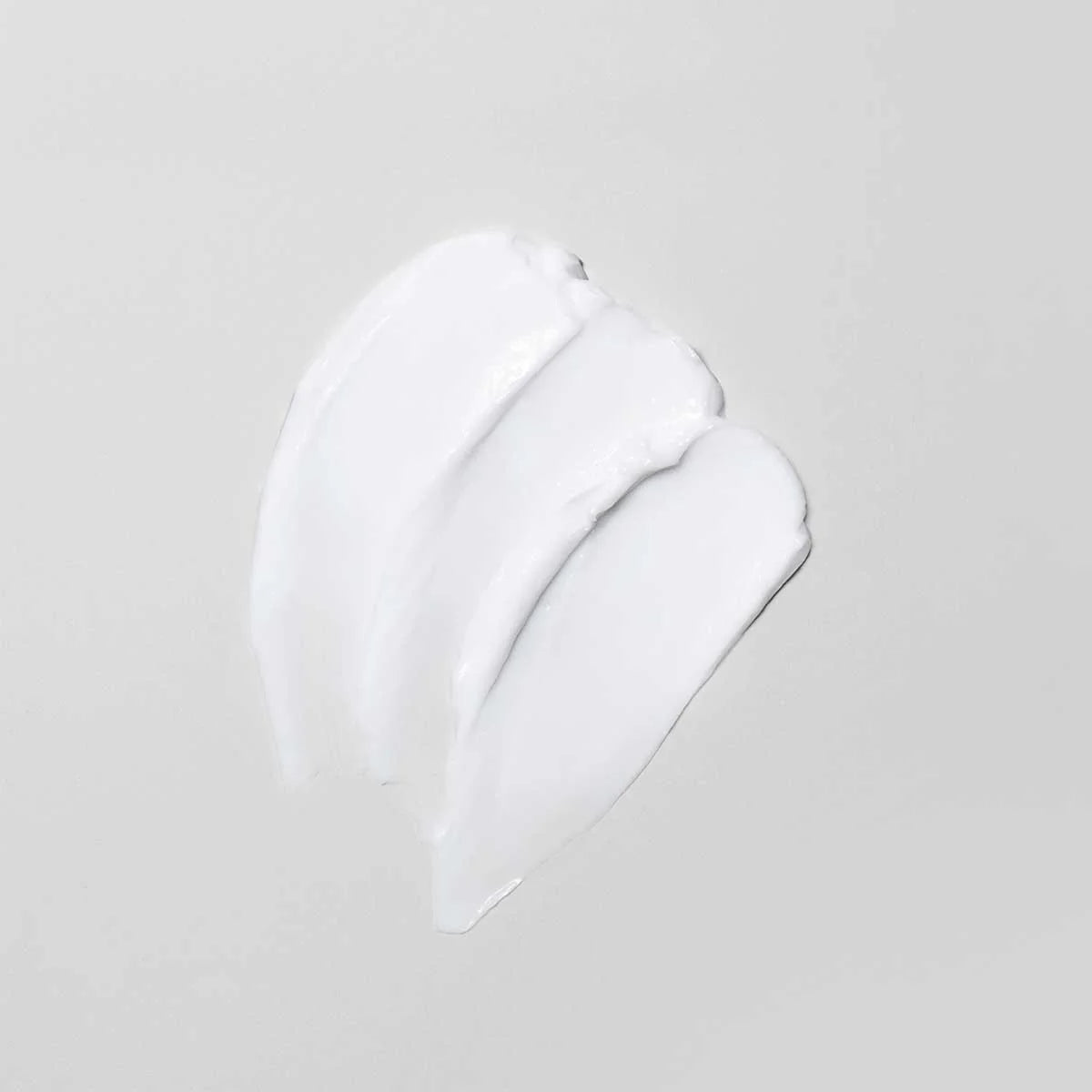 White texture of Oi Conditioner  on a light gray background