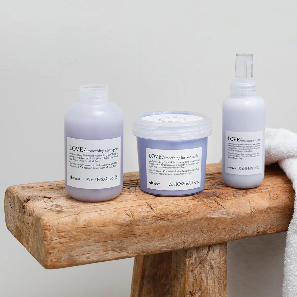 Three Davines LOVE smoothing hair care products for coarse or frizzy hair