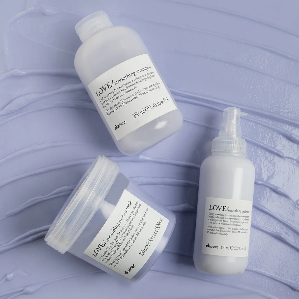 Three Davines LOVE smoothing hair care products for coarse or frizzy hair