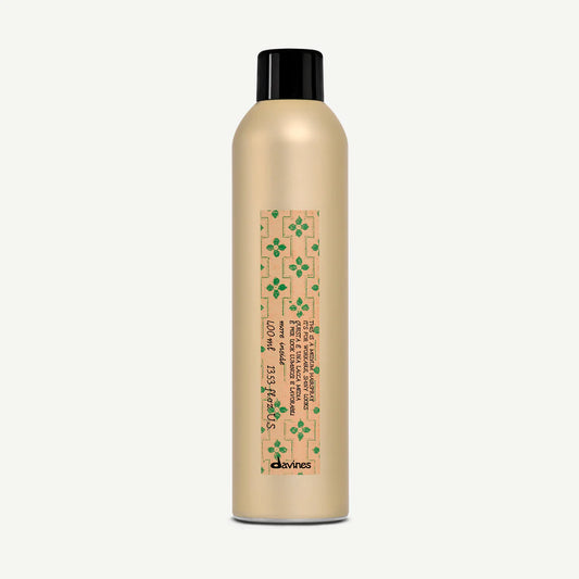 Gold bottle of Davines More Inside This Is a medium hairspray for workable, shiny looks