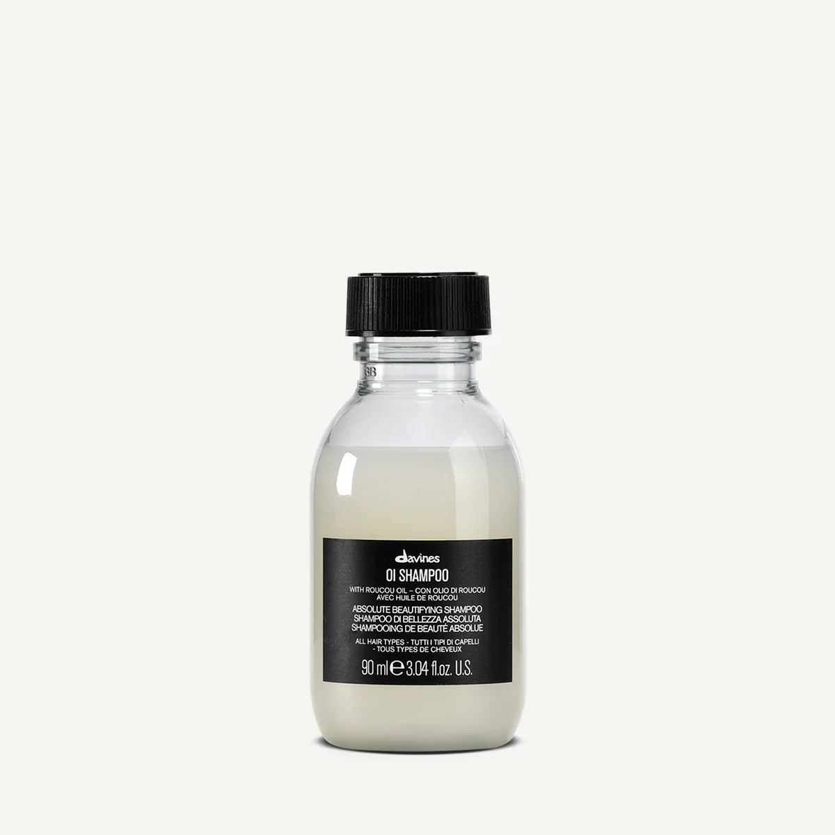 Bottle of Davines OI Shampoo with roucou oil for all hair types