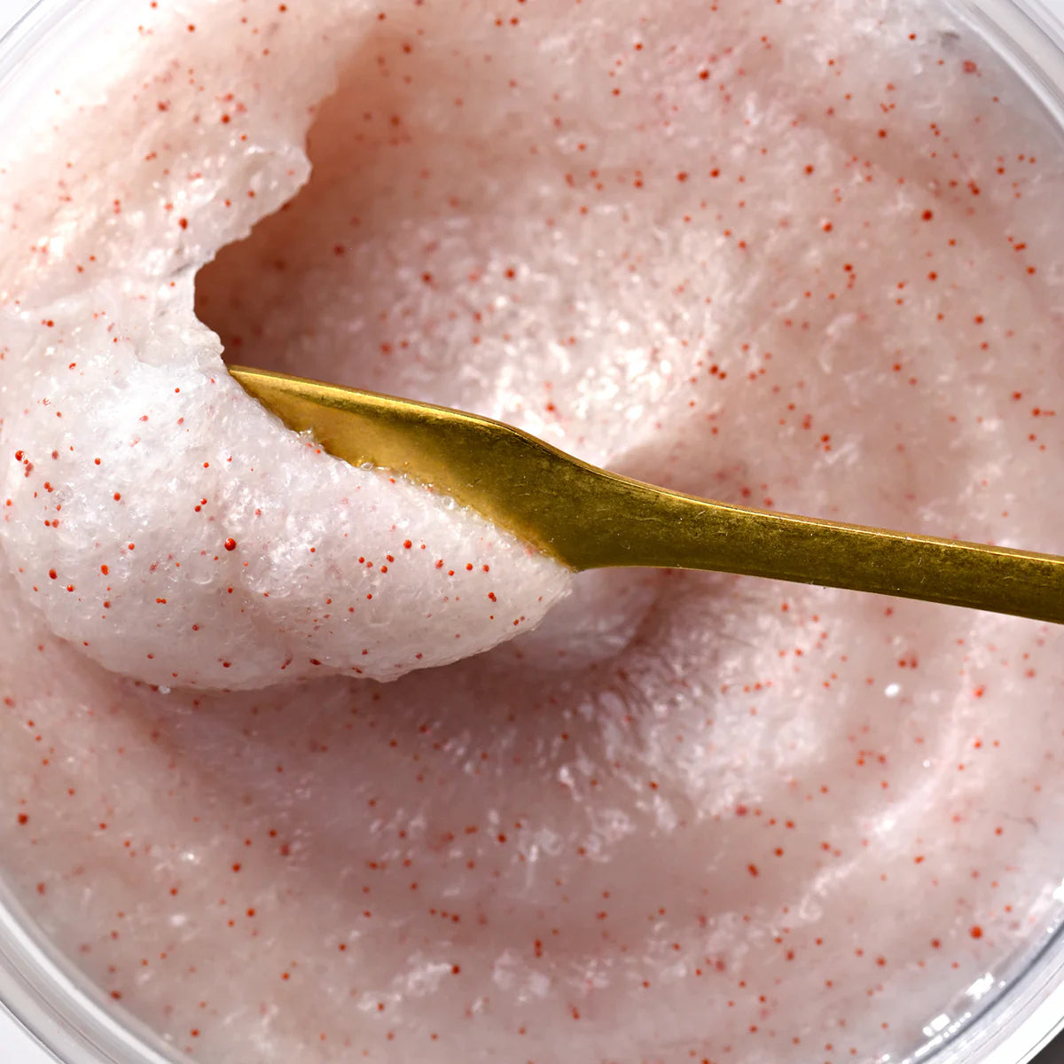 Pink cleansing SOLU scrub with red specks for all hair types