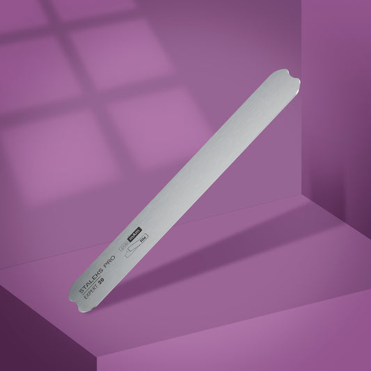 Metal straight base for nail Staleks on a purple surface with a soft shadow